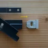 pièce d'arrivée a fixer avec une vis en fin de travée